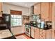 Cozy kitchen with stainless steel oven, modern cabinets, and black countertops at 55 Delmont Ne Dr # C3, Atlanta, GA 30305