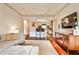 Open living room with seamless transition to the kitchen and hardwood flooring at 55 Delmont Ne Dr # C3, Atlanta, GA 30305