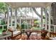 Relaxing screened-in porch with comfortable seating and natural views at 55 Delmont Ne Dr # C3, Atlanta, GA 30305