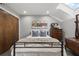 Cozy bedroom with queen-size bed, closet, dresser, and skylight providing natural light at 30 5Th Ne St # 1010, Atlanta, GA 30308