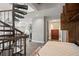 Bedroom featuring a murphy bed, spiral staircase leading to a living room, and built in storage at 30 5Th Ne St # 1010, Atlanta, GA 30308
