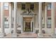 Elegant building entrance with large columns, benches, and ornate doorway at 30 5Th Ne St # 1010, Atlanta, GA 30308