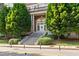 Classic brick building with a grand entrance and mature landscaping at 30 5Th Ne St # 1010, Atlanta, GA 30308