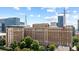 Biltmore House exterior with its architecture against a backdrop of surrounding cityscape with other high-rise buildings at 30 5Th Ne St # 1010, Atlanta, GA 30308