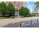 Exterior view of a historic building with trees and cityscape in the background at 30 5Th Ne St # 1010, Atlanta, GA 30308