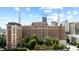 View of a large historic building with surrounding trees against a blue sky at 30 5Th Ne St # 1010, Atlanta, GA 30308