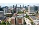 Aerial cityscape view featuring the Biltmore House surrounded by modern skyscrapers, showing its location in a bustling urban area at 30 5Th Ne St # 1010, Atlanta, GA 30308
