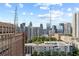 Expansive city skyline view with historic buildings and modern skyscrapers under a bright sky at 30 5Th Ne St # 1010, Atlanta, GA 30308