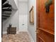 Foyer with a brick floor and staircase detail at 30 5Th Ne St # 1010, Atlanta, GA 30308