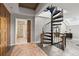 Hallway view with custom wood detailing, spiral staircase and bathroom access at 30 5Th Ne St # 1010, Atlanta, GA 30308
