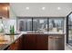 Beautiful kitchen with stainless steel dishwasher and sink overlooking city buildings at 30 5Th Ne St # 1010, Atlanta, GA 30308