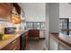 Well-lit kitchen with stainless steel appliances, wooden cabinets, and city view at 30 5Th Ne St # 1010, Atlanta, GA 30308