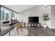 Bright living room featuring cityscape views, a desk area, and a comfortable seating arrangement at 30 5Th Ne St # 1010, Atlanta, GA 30308
