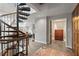 Open living room and spiral staircase with access to the bedroom at 30 5Th Ne St # 1010, Atlanta, GA 30308