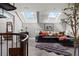 A modern living room with skylights and a dark leather sectional sofa at 30 5Th Ne St # 1010, Atlanta, GA 30308