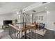 Modern living space with sleek staircase, dining area, and abundant natural light from recessed lighting at 30 5Th Ne St # 1010, Atlanta, GA 30308
