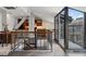 Spacious living area showcasing a staircase, modern kitchen, and balcony access with city views at 30 5Th Ne St # 1010, Atlanta, GA 30308
