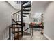 Unique spiral staircase leading to a cozy living area with comfortable seating and skylight views at 30 5Th Ne St # 1010, Atlanta, GA 30308