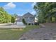 Beautiful backyard with ample green space, perfect for outdoor activities and relaxation, with attached garage at 3123 Wolf Club Dr. Sw, Atlanta, GA 30349
