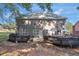 Expansive backyard featuring multiple decks, perfect for entertaining guests outdoors at 3123 Wolf Club Dr. Sw, Atlanta, GA 30349