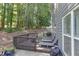 Relaxing backyard deck with wooden railing and multiple lounge chairs at 3123 Wolf Club Dr. Sw, Atlanta, GA 30349