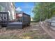 Multi-level deck with seating area and a built-in grill, perfect for outdoor entertaining with some yard remaining at 3123 Wolf Club Dr. Sw, Atlanta, GA 30349