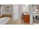 Bathroom features a soaking tub, double sink vanity with granite counters, and access to the main bedroom at 3123 Wolf Club Dr. Sw, Atlanta, GA 30349