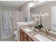 Stylish bathroom with a dual sink vanity, granite counters, and spa-like decor at 3123 Wolf Club Dr. Sw, Atlanta, GA 30349