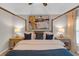 Charming bedroom with a four-poster bed, artistic decor, and ambient lighting at 3123 Wolf Club Dr. Sw, Atlanta, GA 30349