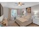 Comfortable bedroom with natural light, a decorative painting and cozy decor at 3123 Wolf Club Dr. Sw, Atlanta, GA 30349