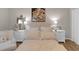 Cozy bedroom featuring a soft color palette, bedside tables, and decorative lamps at 3123 Wolf Club Dr. Sw, Atlanta, GA 30349