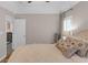 Bright bedroom with a tray ceiling, plantation shutters, plush carpeting, and neutral decor at 3123 Wolf Club Dr. Sw, Atlanta, GA 30349