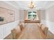 Elegant dining room with large window and chandelier, offering an open space for meals and gatherings at 3123 Wolf Club Dr. Sw, Atlanta, GA 30349