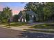 Charming two-story home boasts a well-manicured lawn and a long driveway leading to a two-car garage at 3123 Wolf Club Dr. Sw, Atlanta, GA 30349
