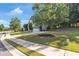 Well-maintained front yard with lush landscaping and a charming walkway leading to the front door of the home at 3123 Wolf Club Dr. Sw, Atlanta, GA 30349
