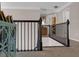 Second floor hallway with dark wood railings overlooking the foyer below at 3123 Wolf Club Dr. Sw, Atlanta, GA 30349