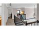 Hallway with black railings and a lantern-style light fixture providing access to multiple rooms at 3123 Wolf Club Dr. Sw, Atlanta, GA 30349