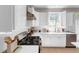 Modern kitchen featuring stainless steel appliances, quartz countertops, and subway tile backsplash at 3123 Wolf Club Dr. Sw, Atlanta, GA 30349