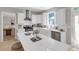 Stylish kitchen features white cabinetry, quartz countertops, and stainless steel appliances at 3123 Wolf Club Dr. Sw, Atlanta, GA 30349