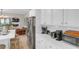 Bright kitchen area with stainless steel appliances, white cabinets, and a view to the Gathering room at 3123 Wolf Club Dr. Sw, Atlanta, GA 30349