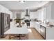 Bright kitchen featuring stainless steel appliances, an island, and white cabinets at 3123 Wolf Club Dr. Sw, Atlanta, GA 30349
