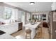 Modern kitchen with white cabinets, stainless steel appliances, and a center island with seating at 3123 Wolf Club Dr. Sw, Atlanta, GA 30349