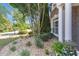 Beautifully landscaped front yard with lush greenery, stone accents, and brick siding at 3123 Wolf Club Dr. Sw, Atlanta, GA 30349