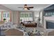 Comfortable living room with a fireplace, large windows, and comfortable seating at 3123 Wolf Club Dr. Sw, Atlanta, GA 30349