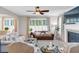 Spacious living room featuring a fireplace, comfortable seating, and ample natural light for relaxation and entertainment at 3123 Wolf Club Dr. Sw, Atlanta, GA 30349