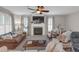 Spacious living room featuring a fireplace, comfortable seating, and lots of natural light at 3123 Wolf Club Dr. Sw, Atlanta, GA 30349