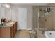 Beautiful main bathroom with double sinks, granite counters, and a glass-enclosed shower at 3123 Wolf Club Dr. Sw, Atlanta, GA 30349