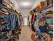 Spacious walk-in closet with ample shelving and storage for clothes, shoes, and accessories at 3123 Wolf Club Dr. Sw, Atlanta, GA 30349