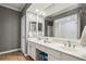 Bathroom features a double sink vanity with a large mirror and white cabinets at 3777 Peachtree Ne Rd # 1216, Atlanta, GA 30319