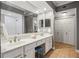 Bathroom featuring double sinks, mirror and cabinet space at 3777 Peachtree Ne Rd # 1216, Atlanta, GA 30319